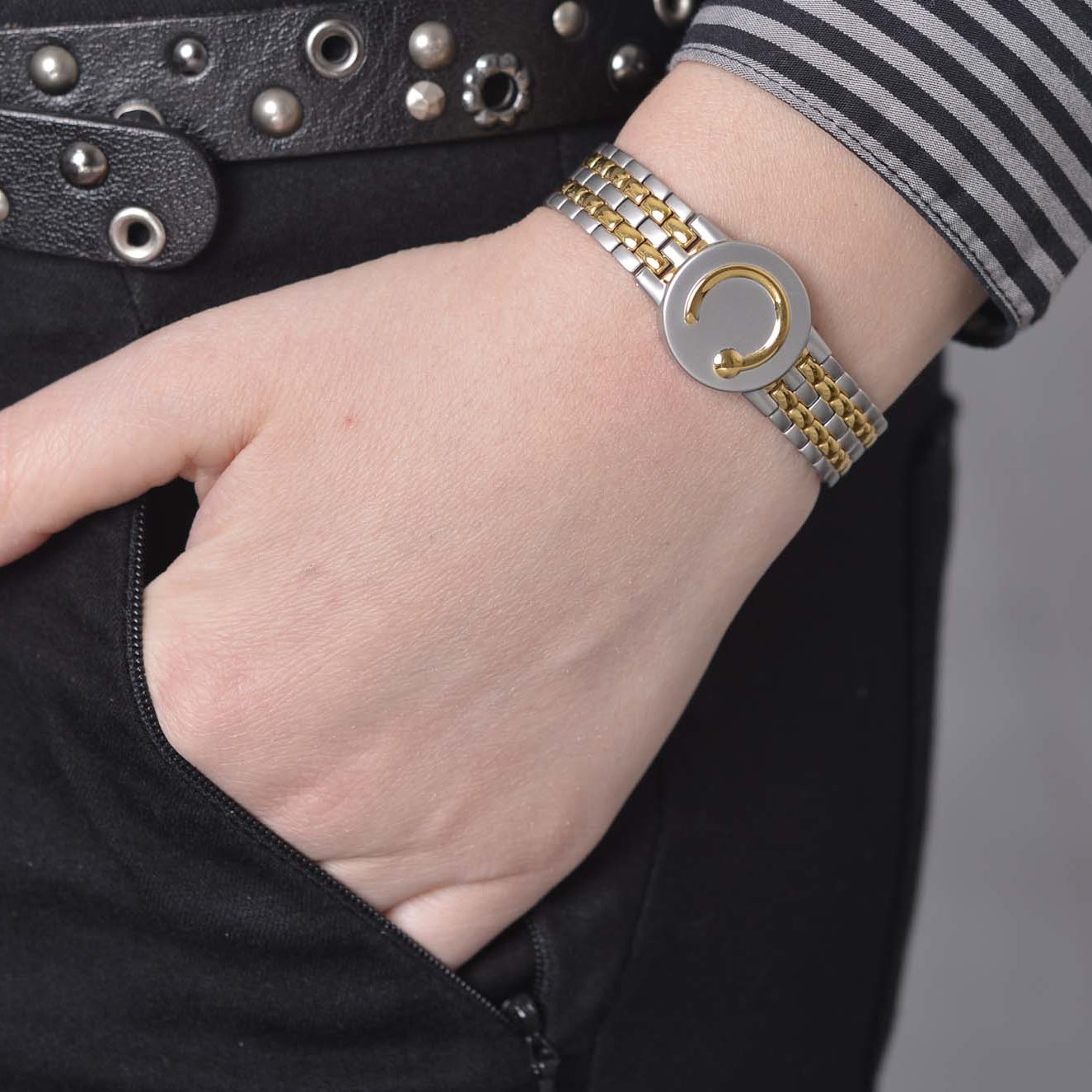 lady wearing a gold and stainless steel elite two toned
